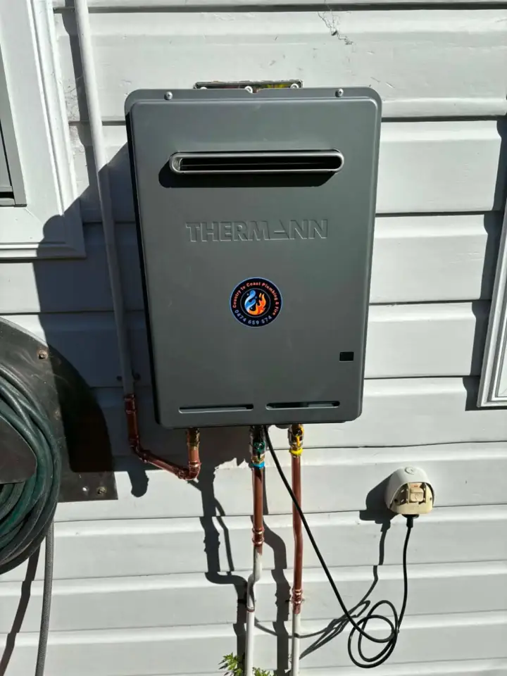 A continuous flow gas water heater on weatherboard
