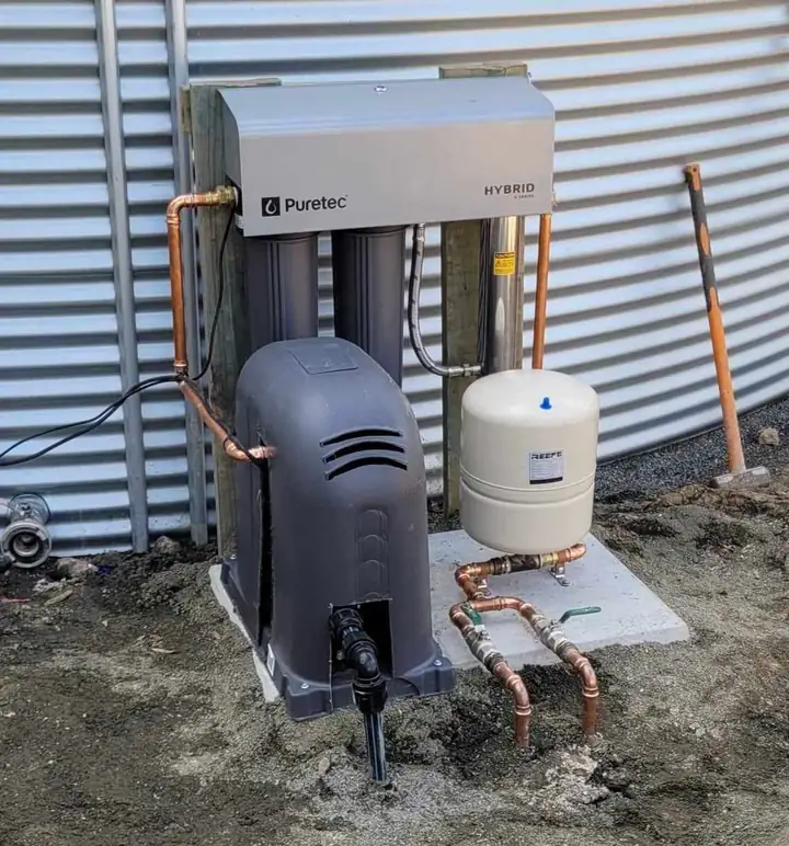 A filter system with a pressure pump on a concrete slab