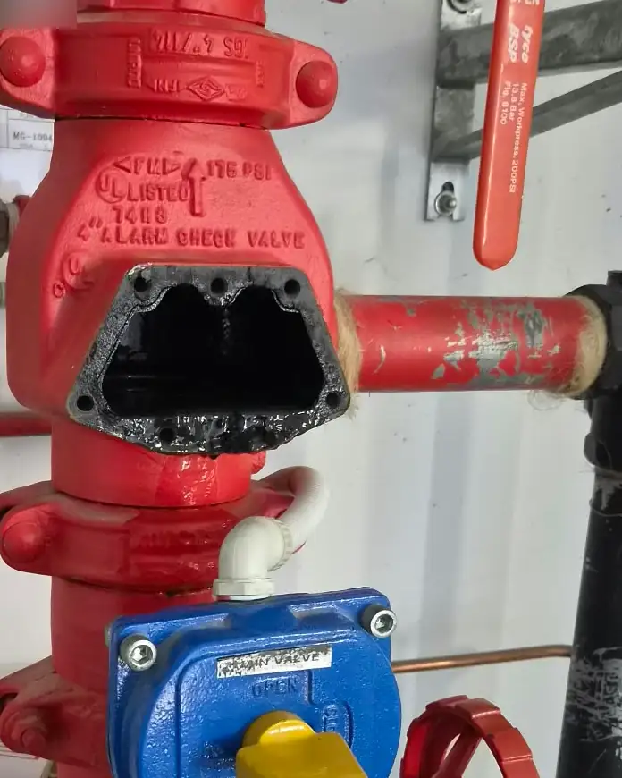 A sprinkler alarm valve with its cover off and gauges fitted